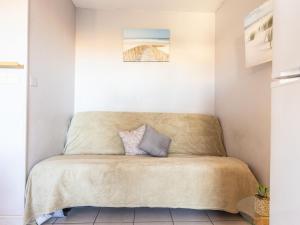 a bed in a corner of a room at Apartment Primavera-4 by Interhome in Agde