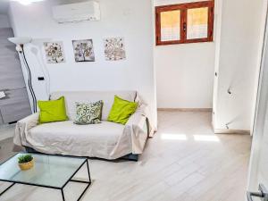 a living room with a couch and a glass table at Apartment Casa Noah by Interhome in Teulada
