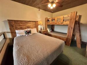 a bedroom with two bunk beds and a ceiling at Condo at Lutsen Mtn, Ski in Ski out, Hike, Bike, Ski, Swim, etc in Lutsen +36 photos