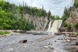 a waterfall in the middle of a river at Condo at Lutsen Mtn, Ski in Ski out, Hike, Bike, Ski, Swim, etc in Lutsen