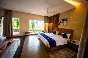 Voodi või voodid majutusasutuse Ananthyam Resort by Anukulas toas