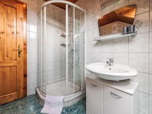 a bathroom with a sink and a shower at Apartment Ferienwohnung Grimmingblick by Interhome in Öblarn