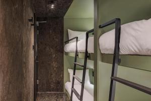 Letto o letti in una camera di Pods by The Usual Rotterdam