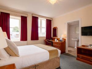 TV a/nebo společenská místnost v ubytování Grant Arms Hotel