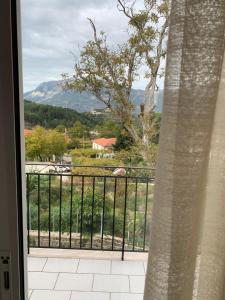 a balcony with a view of a mountain at Madelulu House in Pramanta