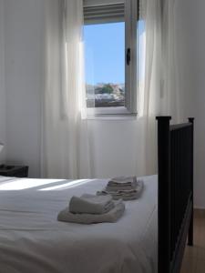 Ένα ή περισσότερα κρεβάτια σε δωμάτιο στο Terrace Serenity