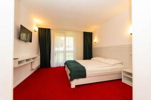 Postel nebo postele na pokoji v ubytování Hotel Cirus