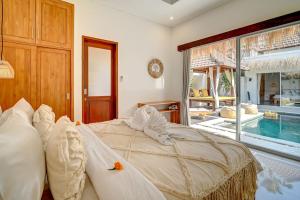 Ένα ή περισσότερα κρεβάτια σε δωμάτιο στο Villa Esha II