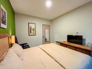 Postel nebo postele na pokoji v ubytování Locus Coliving