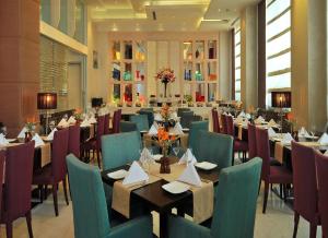 A restaurant or other place to eat at Park Plaza Faridabad
