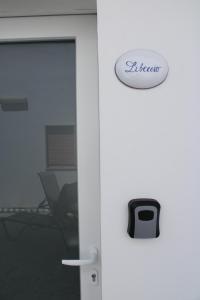 an office door with a sign that reads fletcher at Le Casette di Eolo in Roca Vecchia +12 photos