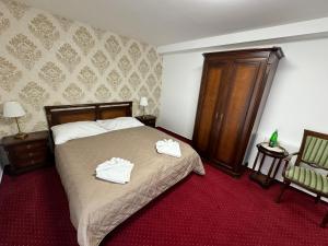Voodi või voodid majutusasutuse Hotel Sebastian u Hoffera toas