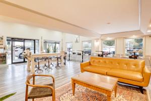 a living room with a couch and a table at The Guest Lodge Gainesville in Gainesville