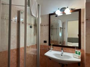 a bathroom with a sink and a mirror at EURO HOUSE INN airport in Fiumicino