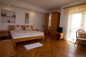 Postel nebo postele na pokoji v ubytování Pension Apartment Granit