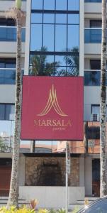 a marriott sign on the side of a building at Apart Hotel 48 in Mogi das Cruzes