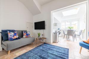 a living room with a couch and a table at Luxury 1 bed Apartment in Portadown