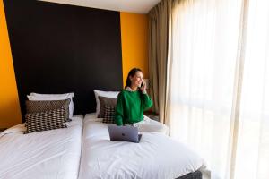 Postel nebo postele na pokoji v ubytování City Hotel Gouda, WorldHotels Crafted Collection