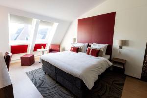 Postel nebo postele na pokoji v ubytování City Hotel Gouda, WorldHotels Crafted Collection