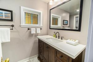 a bathroom with a sink and a mirror at Northgate in Saugatuck +43 photos