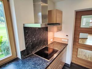 Η κουζίνα ή μικρή κουζίνα στο Apartment Bella Monte-5 by Interhome