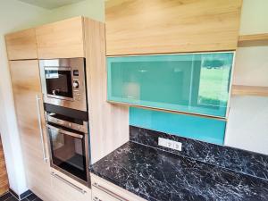 Η κουζίνα ή μικρή κουζίνα στο Apartment Bella Monte-5 by Interhome