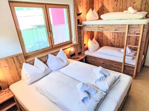 a bedroom with two bunk beds and a window at Apartment Bella Monte-5 by Interhome in Pettneu am Arlberg