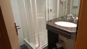 Um banheiro em Hotel Jose Alberto