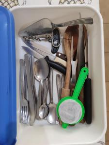 a drawer full of utensils in a container at Colonial Praiano in Guarapari