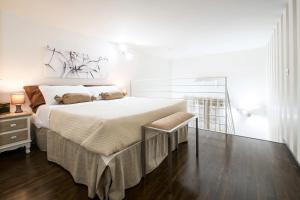 a bedroom with a large bed and a window at Quattro Canti Apartments in Palermo