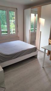Postel nebo postele na pokoji v ubytování Maison au 19