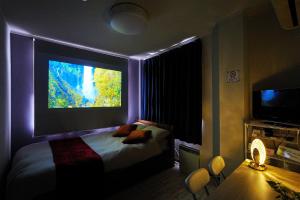 a bedroom with a bed with a large window at ロワジール岩槻301 in Iwatsuki +52 photos