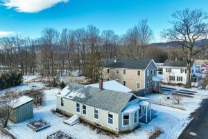 an aerial view of a house in the snow at Comfortable Lincoln Home Walk to Main Street! in Lincoln