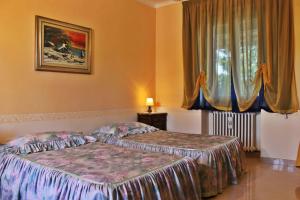 Postel nebo postele na pokoji v ubytování Hotel Ristorante La Torretta