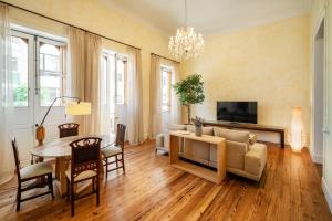 a living room with a table and a couch at Panasco Real Suite - Panasco Suites in Arrecife