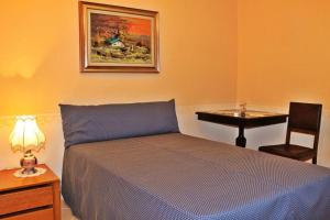 Postel nebo postele na pokoji v ubytování Hotel Ristorante La Torretta