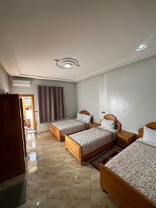 Postel nebo postele na pokoji v ubytování Hôtel Imilchil