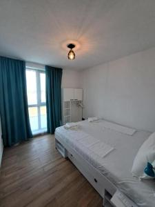 a bedroom with a large bed and a large window at 3-Bedroom Villa in Lozenets, Burgas, Bulgaria in Lozenets