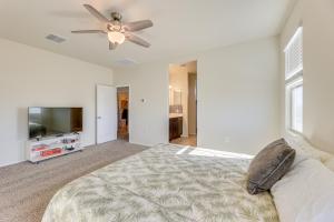 a bedroom with a bed and a ceiling fan at Family-Friendly Home with Playroom in San Tan Valley in San Tan Valley