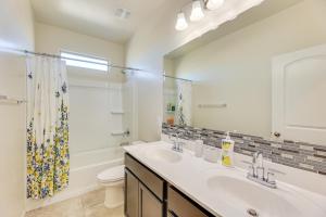 a bathroom with a sink and a toilet and a mirror at Family-Friendly Home with Playroom in San Tan Valley in San Tan Valley +22 photos