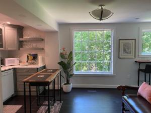 a kitchen with a table and a window at Trouvaille House Sweet Suite in Harpers Ferry