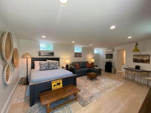 a bedroom with a bed and a living room at The Bears Den at La Soledad in Harpers Ferry