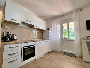 Kuchyň nebo kuchyňský kout v ubytování Apartment Butkovic