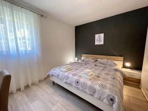 Postel nebo postele na pokoji v ubytování Apartment Butkovic