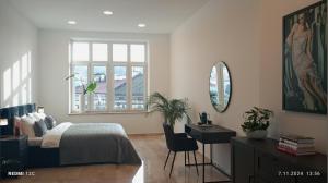 Ένα ή περισσότερα κρεβάτια σε δωμάτιο στο Apartament Secesja