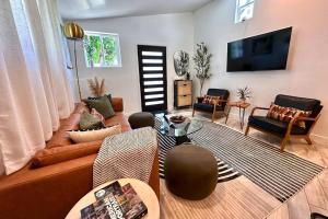 a living room with a couch and a table at Casa Agave, 2 Bedroom, 1 Bath Guest House, with 3 Beds & Game Room in Vista