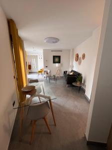 a living room with a couch and a table at Apartamentos Granada 76 in Nerja