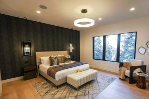 a bedroom with a bed and a large window at Park city Pines retreat sleeps 22! in Park City