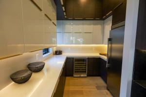 a kitchen with a counter with two bowls on it at Park city Pines retreat sleeps 22! in Park City +119 photos