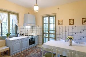 a kitchen with a table and a stove top oven at il nuvoloso 2 in Città della Pieve +13 photos